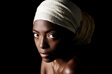 Image showing Beauty, portrait and serious black woman in headscarf, natural makeup or creative aesthetic in studio. Art, skincare and African girl on dark background with head wrap, facial cosmetics or confidence