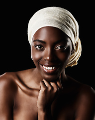 Image showing Smile, portrait and black woman with head wrap, natural makeup and creative beauty aesthetic in studio. Art, skincare and African girl on dark background with scarf, facial cosmetics and confidence.