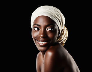 Image showing Beauty, studio and happy black woman with headscarf, natural makeup or creative aesthetic in mockup space. Art, skincare and African girl on dark background with wrap, facial cosmetics and confidence