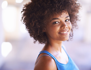 Image showing Woman, portrait and happiness in fashion with lens flare, natural beauty and casual outfit in summer. African person, face and smile with afro hairstyle, wellness or trendy style with bokeh in Africa