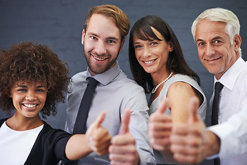 Image showing Business people, teamwork and thumbs up in studio portrait for success, winning and achievement or thank you emoji. Professional group with mature boss for like, yes and feedback on a wall background