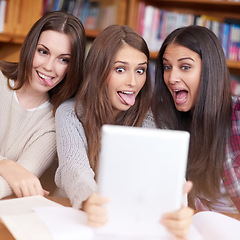 Image showing Women, students or tablet selfie in college library or bonding together for crazy update on social media. Learners, touchscreen or post online as goofy friends or solidarity with care in university
