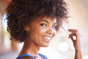 Image showing Woman, portrait and happiness in hair care with bokeh, natural beauty and collagen treatment with confidence. African person, face and smile with afro hairstyle, wellness or lens flare in Amsterdam