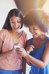 Image showing Friends, phone and laugh for message on social media, internet and reading funny notification outdoors. Happy women, students and bonding at university, comedy and humor in conversation on app or web