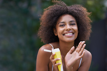 Image showing African, woman and sunscreen happy in nature, body care or lotion for heat or sun protection with natural female person. Smiling, excited girl with product tube or summer fun on holiday retreat
