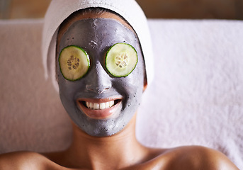 Image showing Woman, cucumber and facial in spa for skincare, beauty and cosmetic treatment for break or peace. Young person and smile with product on face for peel for natural or holistic therapy for wellness