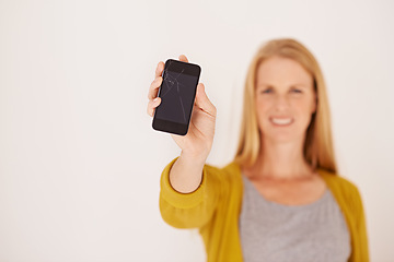 Image showing Woman, hand and blank phone screen in studio portrait with smile for mock up space by white background. Person, smartphone and happy for ux, mobile application and show for communication on network
