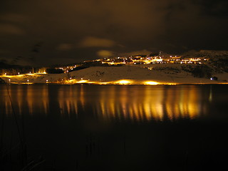 Image showing Lights reflecting in water at night