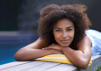 Image showing Deck, portrait and black woman relax at poolside for travel, break or chilling in a backyard on vacation. Face, smile and African female person at a wellness resort for resting on Thailand holiday