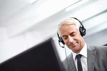 Image showing Call center, happy and man in office with headset working on online telemarketing consultation. Smile, customer support and professional male consultant with crm service communication in workplace.