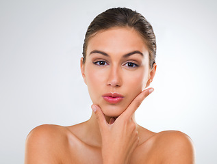 Image showing Woman, portrait and confidence in skincare with beauty, cosmetics and dermatology for glow on white background. Face, skincare treatment and wellness for antiaging, shine and natural in studio