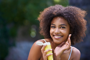 Image showing African, woman and sunscreen and hand in nature, body care or lotion for heat or sun protection with natural female person. Smiling, excited girl with product tube or summer fun on holiday retreat