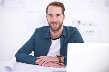 Image showing Portrait, laptop and blueprint with architecture man in office with documents for building, design or planning. Architect, construction and industry with confident young developer in workplace
