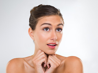 Image showing Woman, thinking and nervous about dermatology, beauty and cosmetics in a studio on white background. Inspiration for skincare, solution to dry skin and glow with waiting for results from treatment