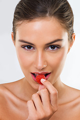 Image showing Woman, portrait and raspberry for wellness in studio for health detox, healthy eating and nutrition diet. Model, person and fruit for organic cosmetics, natural beauty or skincare on white background