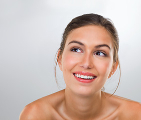 Image showing Woman, thinking and skincare with smile for beauty, dermatology and antiaging treatment shine isolated on white background. Reflection, cosmetic care and healthy skin glow with makeup in studio