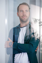 Image showing Design, thinking and arms crossed with architect man in glass boardroom of office for design. Future, planning and vision with confident young developer in workplace for architecture or collaboration