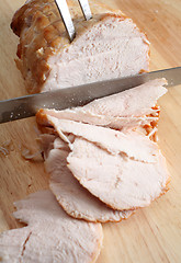 Image showing Carving boneless turkey joint