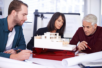 Image showing Team, architect and meeting with model for building, house and planning together at workspace. Engineer, group and partnership working on collaboration, thinking or 3d of design for construction