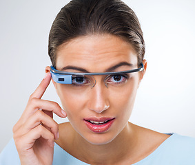 Image showing Portrait, woman or smart glasses for augmented reality, metaverse or serious in studio isolated on white background. Face, cyber eyewear or future technology, virtual or digital spectacles for vision