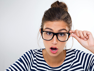 Image showing Confused, woman and portrait with surprise in studio, white background and mockup with questions. Doubt, why and student with glasses and emoji of anxiety for feedback or information with stress