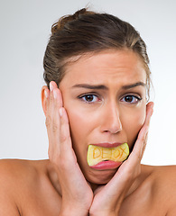 Image showing Woman, portrait and apple for detox diet in studio or unhappy or hungry health or food nutrition, mockup space or organic. Female person, fruit and white background for vitamin, weightloss or snack