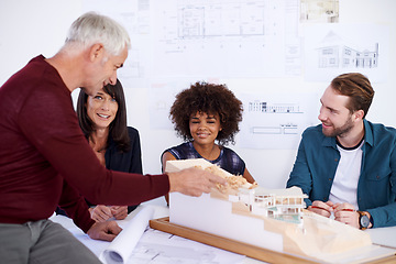 Image showing Employees, model and presentation for industrial architecture, project layout and meeting for construction. Property developers or engineers with 3d graphic or design and remodeling from blueprint.