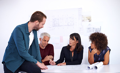 Image showing Blueprint, meeting and business people with teamwork, architecture and planning in a meeting. Staff, coworkers and men with women or partnership with construction and engineering with design or ideas