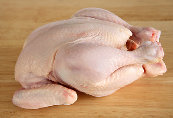 Image showing Raw chicken on a chopping board