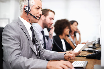 Image showing Call center, career and man in office with headset working on online telemarketing consultation. Happy, customer support and professional male consultant with crm service communication in workplace.