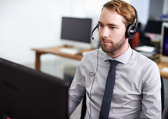 Image showing Call center, customer support and man in office with headset working on online telemarketing consultation. Career, ecommerce and male consultant or agent with crm service communication in workplace.