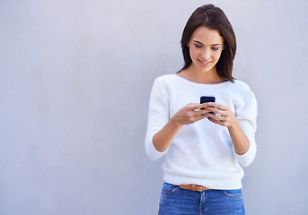 Image showing Happy, woman and smartphone typing, casual female person on social media for browsing and information search. Internet, online reading and web connection for communication and technology device