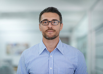 Image showing Portrait, serious and business man in office, workplace or company for job opportunity. Face, glasses and professional entrepreneur, employee and confident salesman working on career in Australia