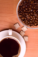 Image showing cup of coffee, beans and sugar