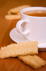 Image showing cup of tea and some cookies