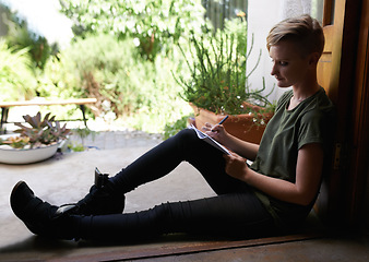 Image showing Woman, home or writing notes on floor on book for remote work, schedule or information by garden. Pen, notepad or student with creative ideas, learning or planning to do list on journal for education