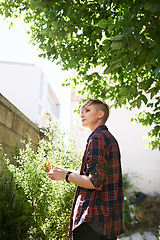 Image showing Woman, tree and thinking in garden by home for summer morning, fresh air or planning for day. Relax, nature and thoughtful female person in backyard for peace, idea or wondering in environment