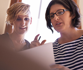 Image showing Planning, collaboration and women with report in office for teamwork, support and feedback on project. People, talking and advice for paperwork, proposal and information in document for business