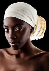 Image showing Beauty, portrait and black woman in studio with headscarf, natural makeup or creative aesthetic. Art, skincare and African girl on dark background with head wrap, facial cosmetics and confidence.