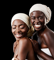 Image showing Black women, head wrap and beauty portrait with smile, skincare and cosmetics in studio with bonding. Girl friends, happy and African scarf with wellness and skin glow with makeup and dark background