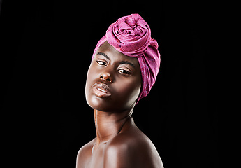 Image showing Black woman, head wrap and portrait with natural beauty, skincare and cosmetics in studio. Traditional, turban and African fashion with wellness and skin glow treatment in makeup with dark background
