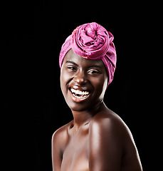 Image showing Black woman, head wrap and beauty portrait with laugh, skincare and natural cosmetics in studio. Traditional, turban and African fashion with wellness and skin glow with makeup and dark background