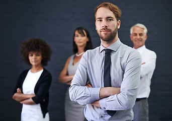 Image showing Professional man, leadership and arms crossed in studio for teamwork, confidence or support on wall background. Serious portrait of people, lawyer or group standing together for law firm or business