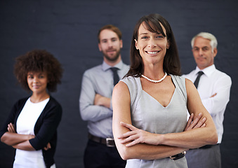 Image showing Business people, leadership and arms crossed for teamwork, confidence and about us on a wall background. Portrait of woman, group and employees in human resources or company with happy job or career