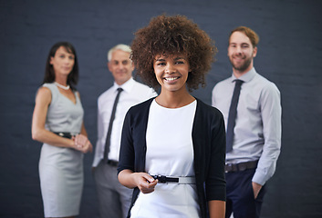 Image showing Portrait, team leader and happy business woman in studio isolated on a blue background. Face, smile and group of diverse professional consultants in collaboration, cooperation and working together