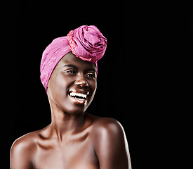 Image showing Black woman, head wrap and laugh with natural beauty, skincare and cosmetics in studio. Traditional, turban and African style with wellness and skin glow in makeup with confidence and dark background
