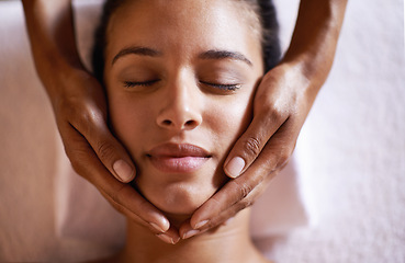 Image showing Woman, relax and face massage at spa with hands and care for facial, wellness and beauty treatment on bed. Above, towel and calm african female woman with skincare and rest at hotel with skin glow