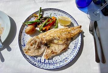 Image showing plate of grilled fish and vegetables