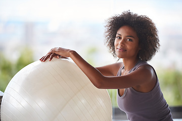 Image showing Woman, portrait and exercise ball for fitness and wellness in studio with smile for health and break. Face of a happy and young African person with workout, pilates and balance for strength practice