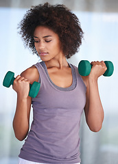 Image showing Woman, fitness and dumbbell for workout, exercise and wellness with power, resilience and strength. Strong, young and African person with training gear, weightlifting and muscle health at her home